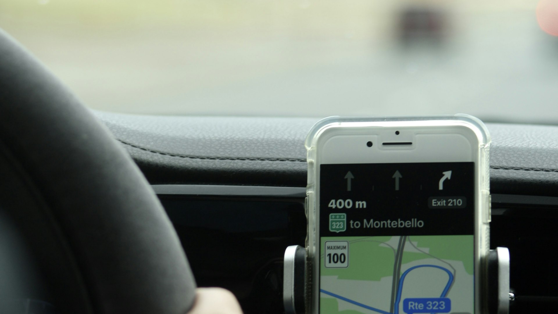 Phone GPS navigation mounted on car dashboard